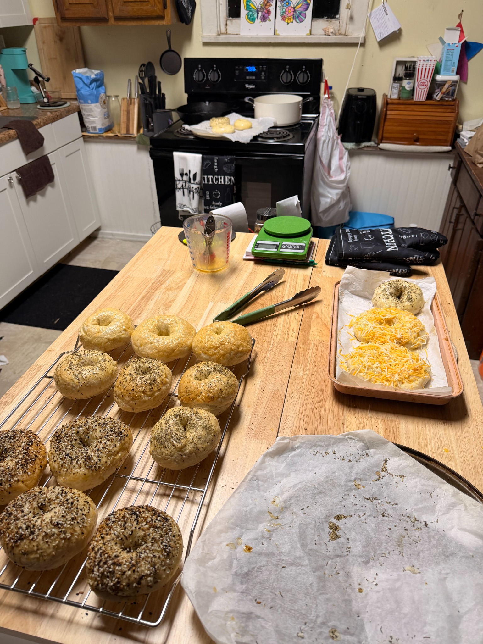 Fresh bagels baking on trays